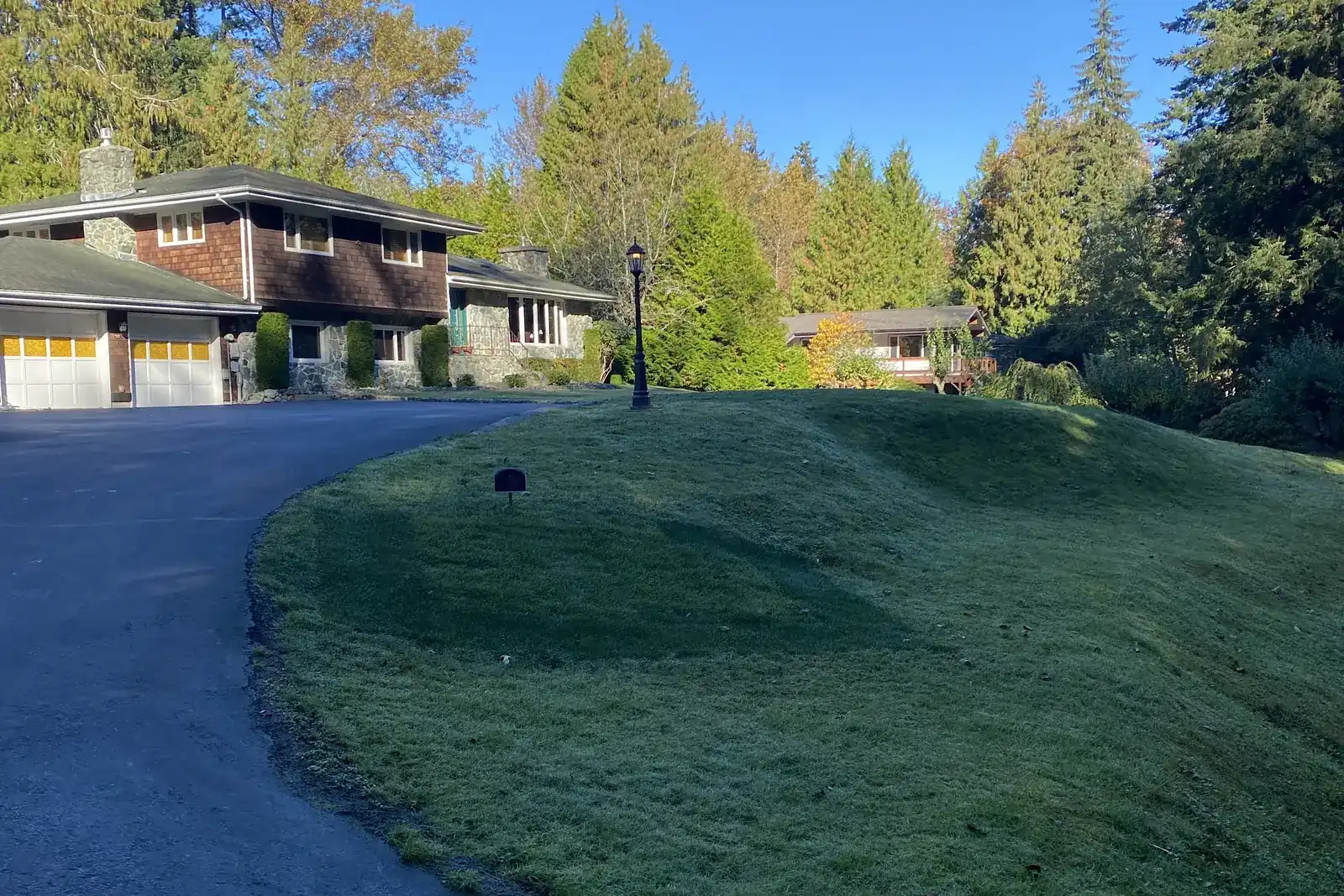 A regraded and reseeded front lawn finished by Cascade Lawn Care