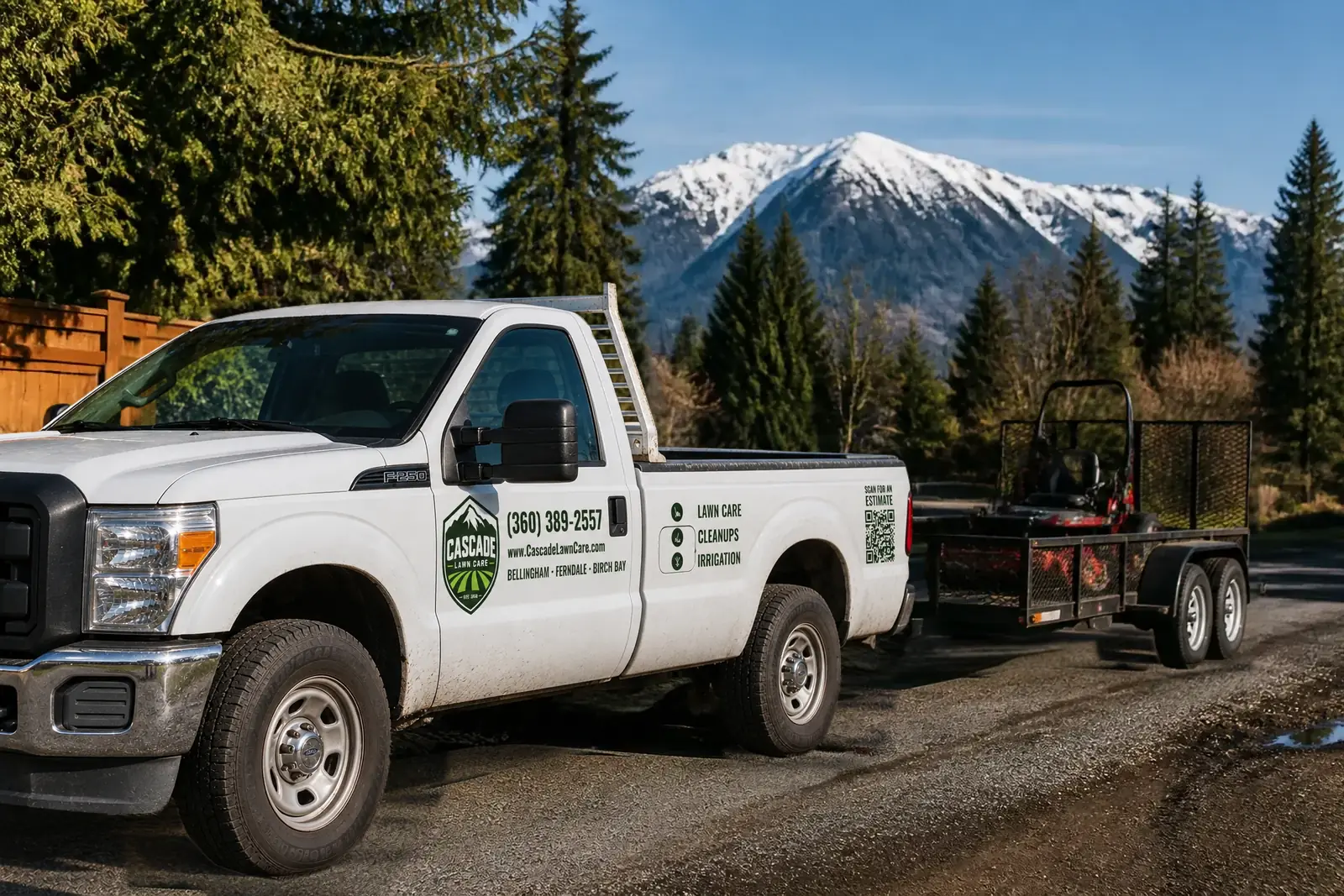 The Cascade Lawn Care truck on a road outside Bellingham with the Cascades behind